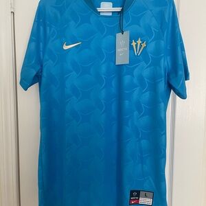 Nike NOCTA Sky Blue Jersey with Gold Accents